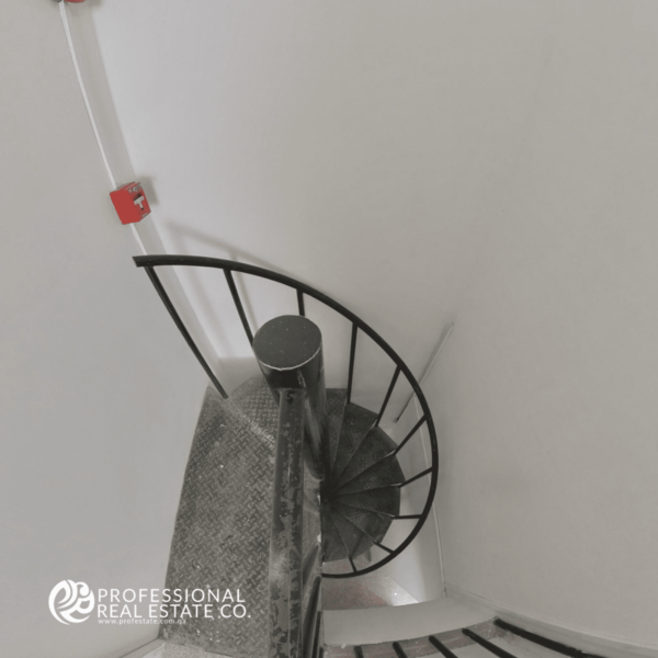 Stairs leading to the first floor of the commercial shop in Al Gharrafa