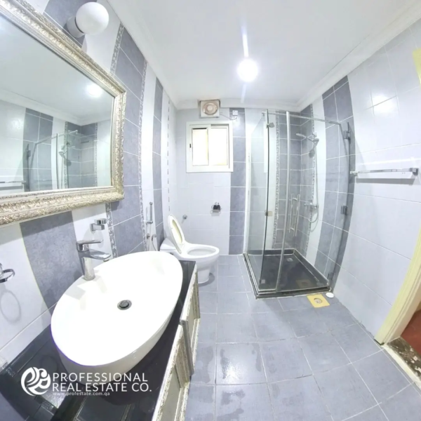 Stylish bathroom in 2 BHK apartment in Mansoura – Modern design with high-end fixtures