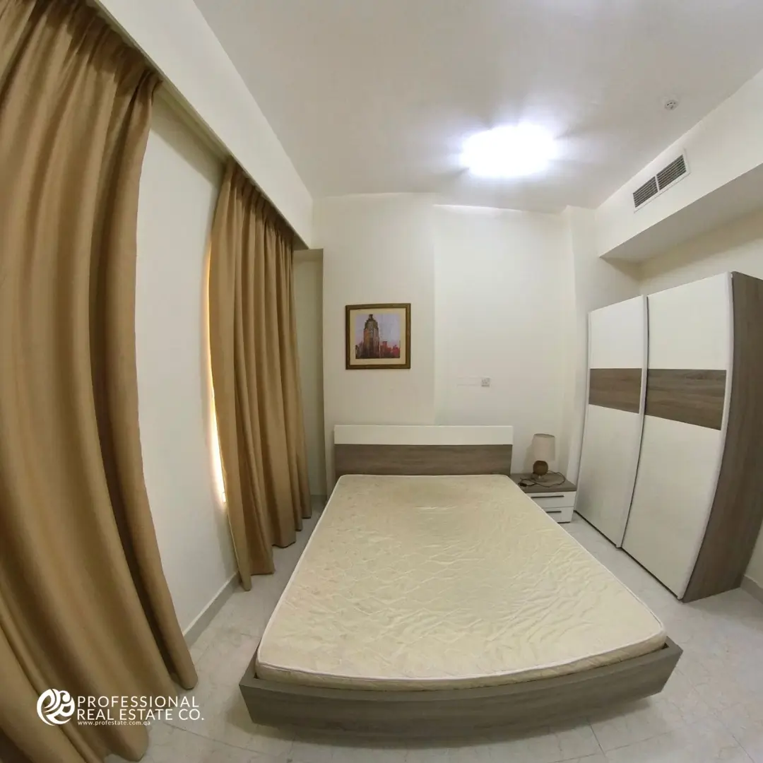 bedroom in fully furnished 3 BHK apartment for rent in Muntazah, Doha – Elegant design with ample storage