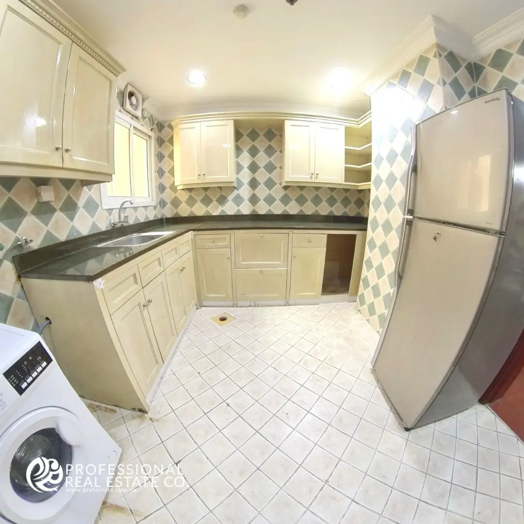 Fully furnished kitchen in 2 BHK apartment in Mansoura – Equipped with modern appliances