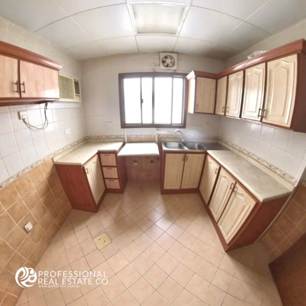 Unfurnished kitchen in the 2 BHK apartment with ample space.