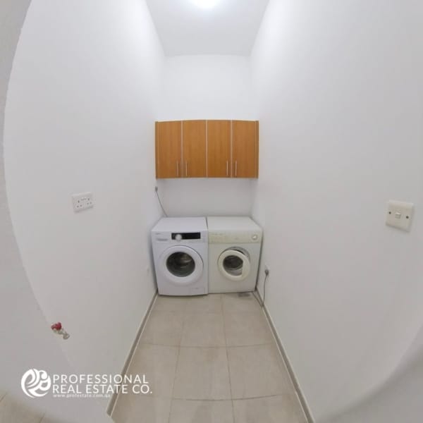 Compact and functional small laundry area in a semi-furnished 3 BHK compound villa in West Bay Lagoon – Convenient for family use.