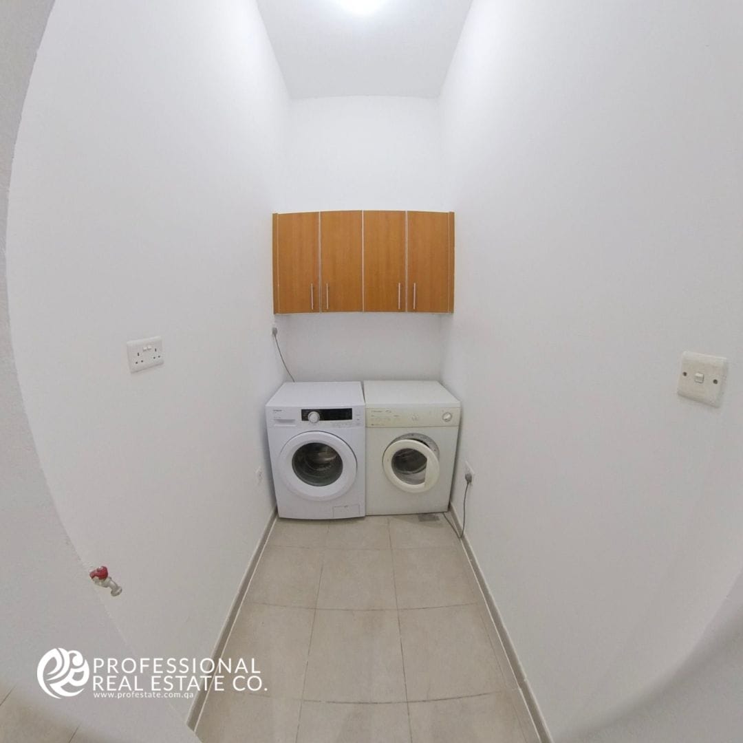 Compact and functional small laundry area in a semi-furnished 3 BHK compound villa in West Bay Lagoon – Convenient for family use.