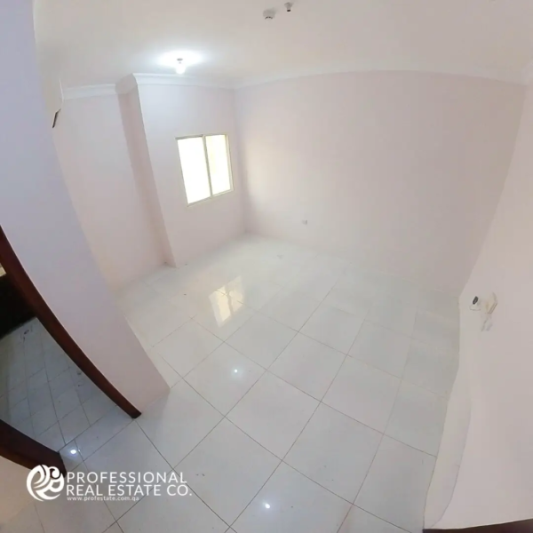 Elegant living room in unfurnished 2 BHK apartment for rent in Bin Omran, Doha – Ideal for customization with ample natural light