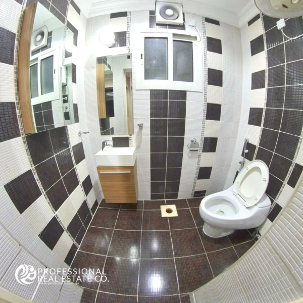 Modern bathroom in 2 BHK apartment in Mansoura – Spacious with high-end fixtures and elegant design