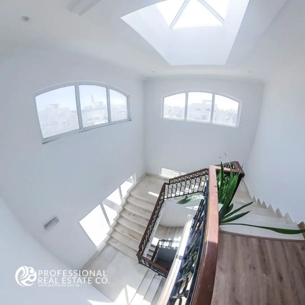 Stairs leading to upper floor of fully furnished 6 BHK villa in Legtaifeya – Elegant and modern staircase design