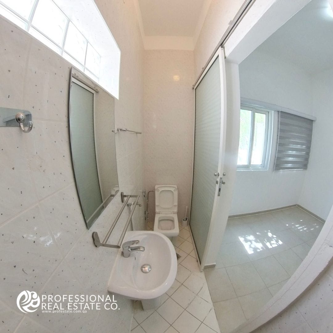 Guest toilet in a semi-furnished 3 BHK compound villa in West Bay Lagoon – Convenient and modern for family and guest use.