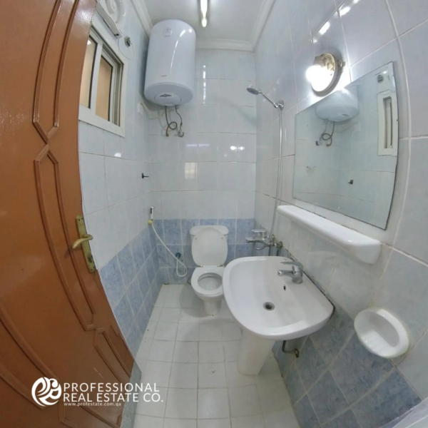 Bathroom in unfurnished 2 BHK apartment in Najma, featuring modern fixtures, spacious layout, and ample natural light.