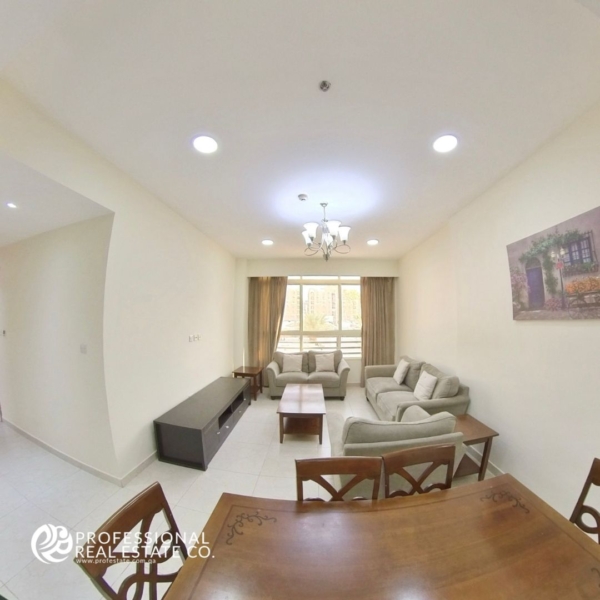 Modern dining area in a fully furnished 2 BHK apartment in Bin Mahmoud, featuring stylish furniture and elegant decor.