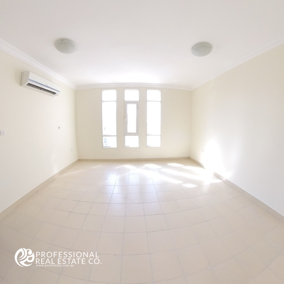 Spacious first bedroom in an unfurnished 5 BHK standalone villa in Al Waab, ideal for family living.