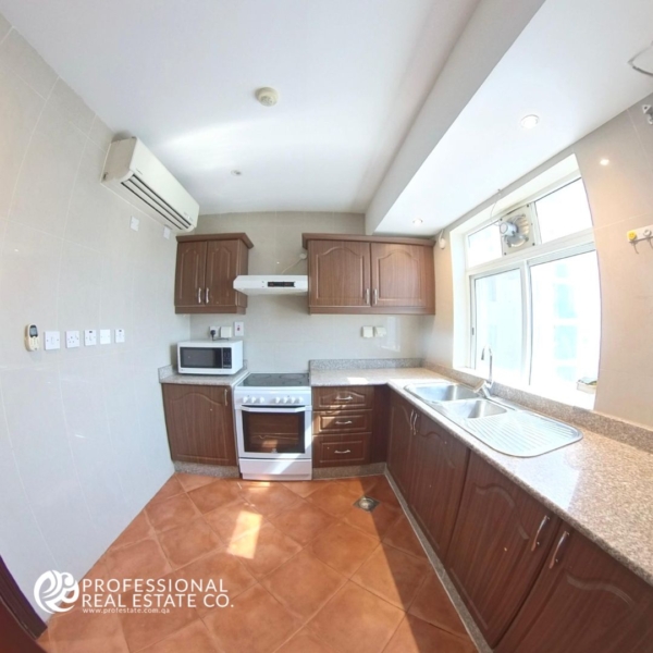 Fully furnished kitchen in 2 BHK apartment in Najma with modern appliances and spacious countertops.