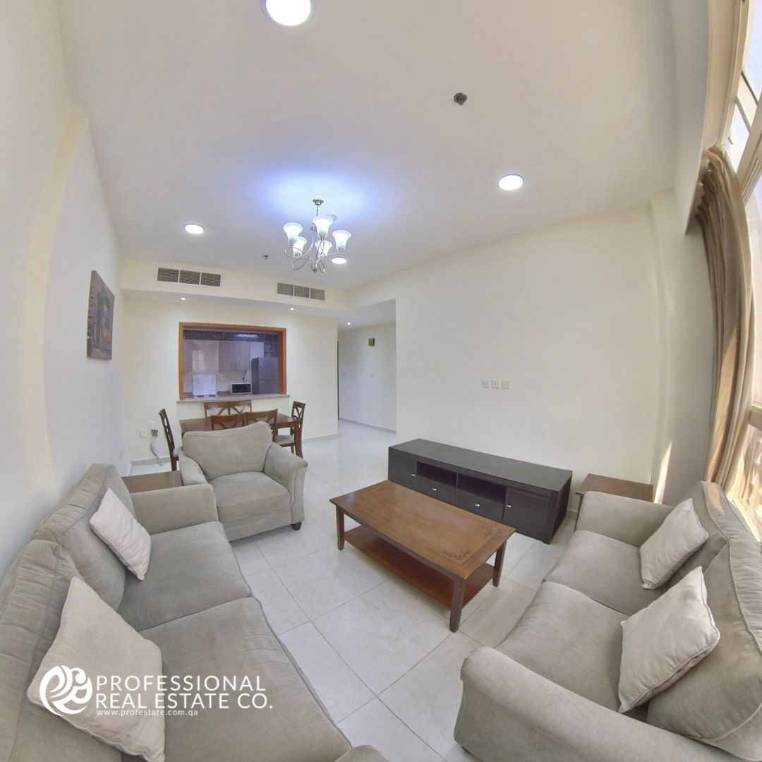 Spacious living area in a fully furnished 2 BHK apartment in Bin Mahmoud, featuring high-quality furniture and stylish decor.