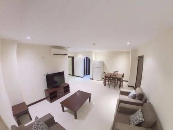 Alternate view of the living room in fully furnished 2 BHK apartment in Najma showcasing spacious layout and modern furnishings.