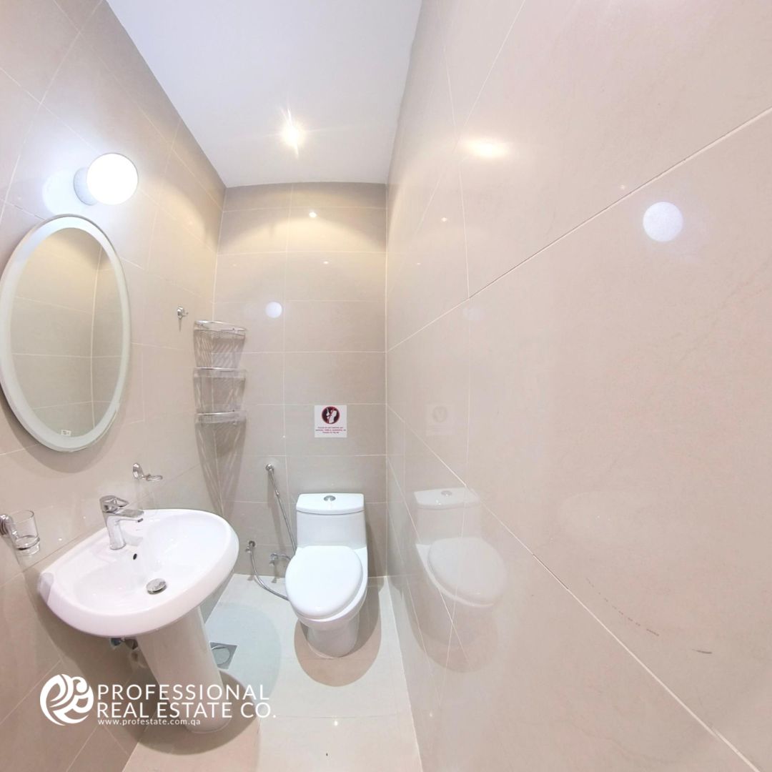 Elegant powder room in fully furnished 2 BHK apartment in Najma with modern fixtures and stylish design.