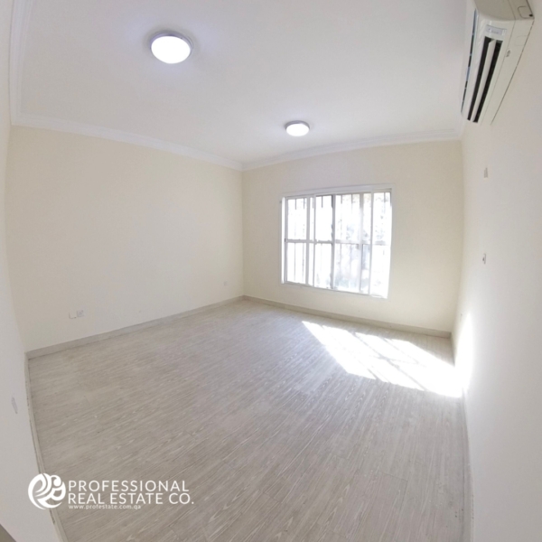 Spacious fifth bedroom in an unfurnished 5 BHK standalone villa in Al Waab, perfect for family living.