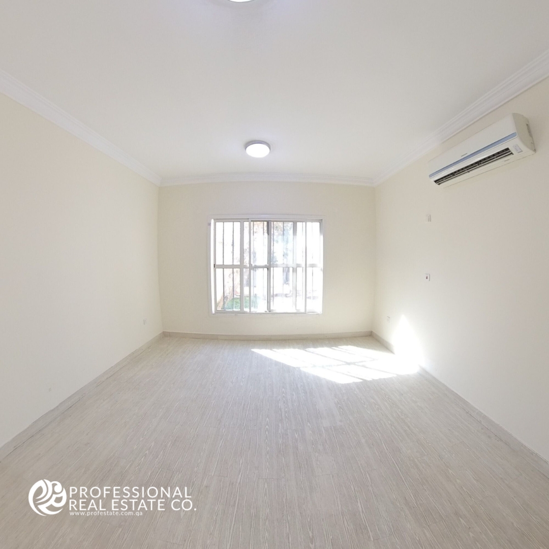 Spacious third bedroom in an unfurnished 5 BHK standalone villa in Al Waab, perfect for family living.