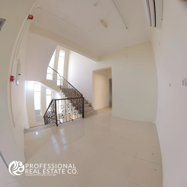 Elegant staircase view on the first floor of an unfurnished 6 BHK standalone villa in Umm Lekhba, offering a stylish and spacious design with customization potential.