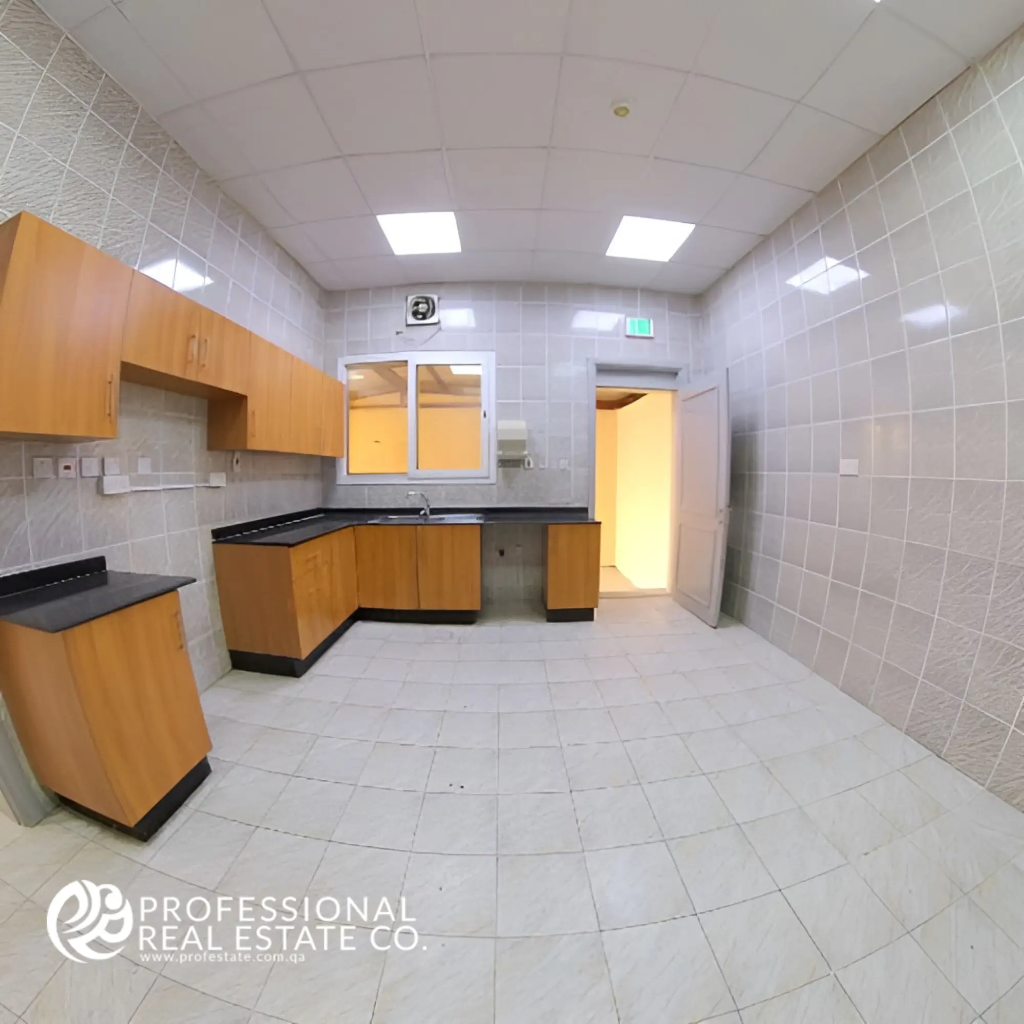 Spacious Closed Kitchen in Unfurnished 6 BHK Standalone Villa in Umm Lekhba – Modern Layout Ideal for Cooking and Entertaining