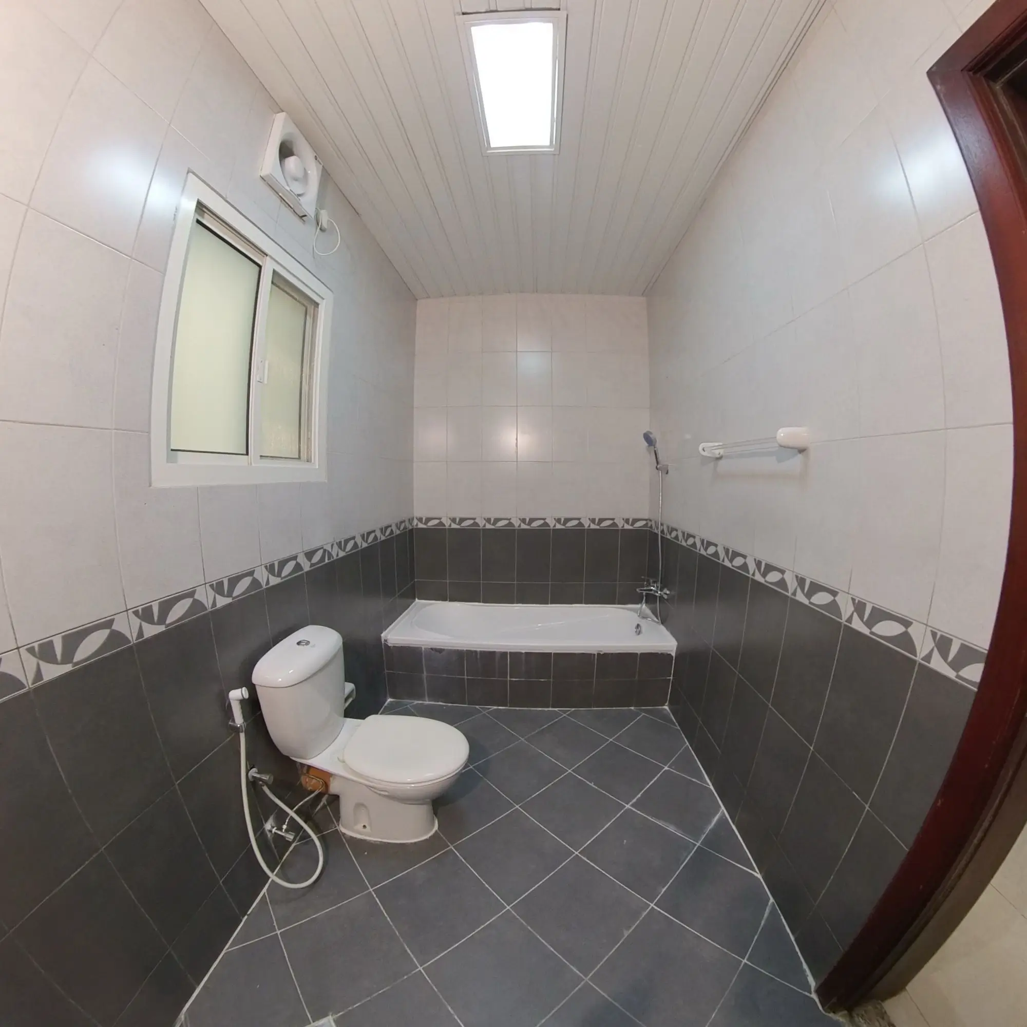 Compact and modern bathroom in an unfurnished 4 BHK apartment for rent in Al Naser, offering potential for customization.