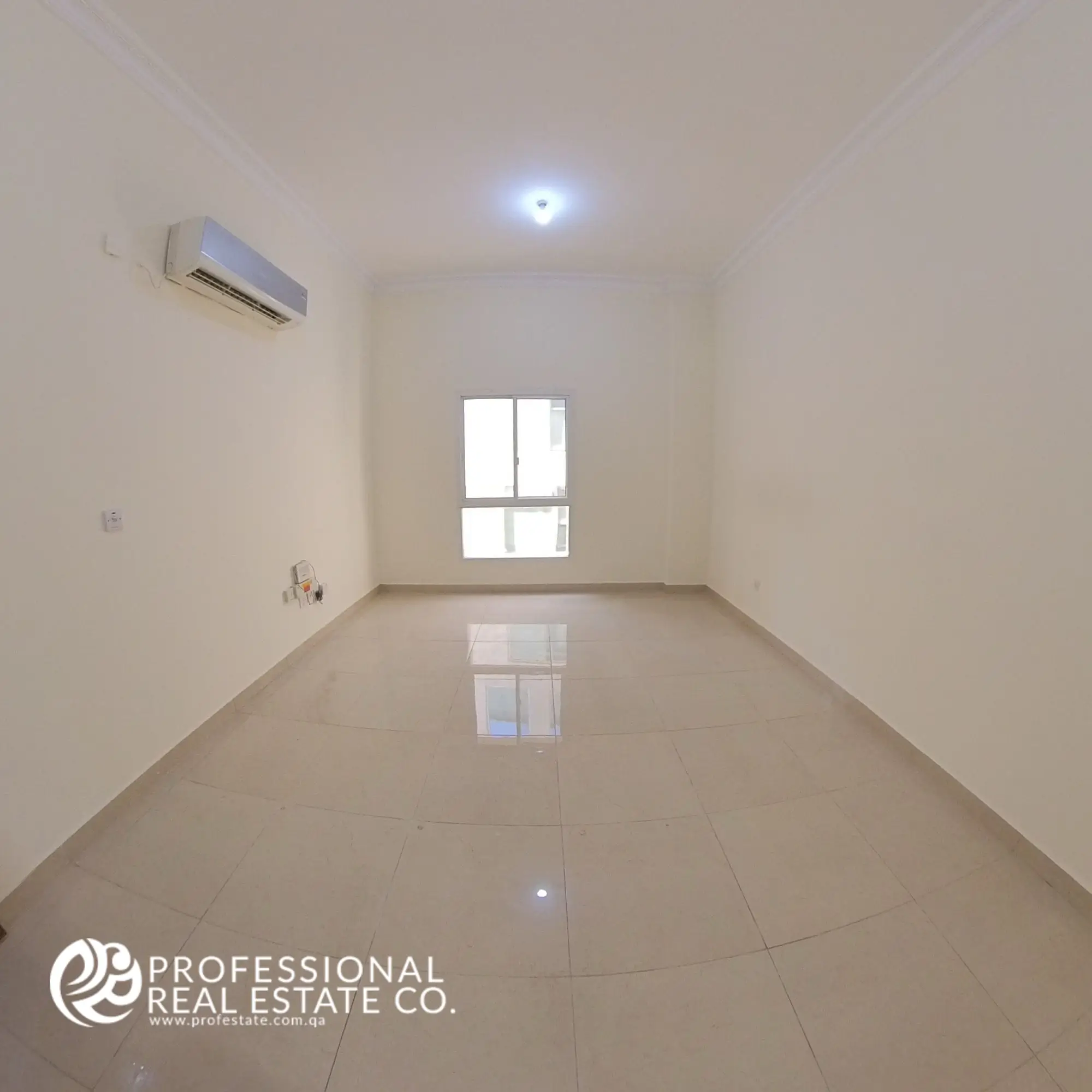 Third bedroom in an unfurnished 4 BHK apartment for rent in Al Naser, offering a flexible space ready for customization.