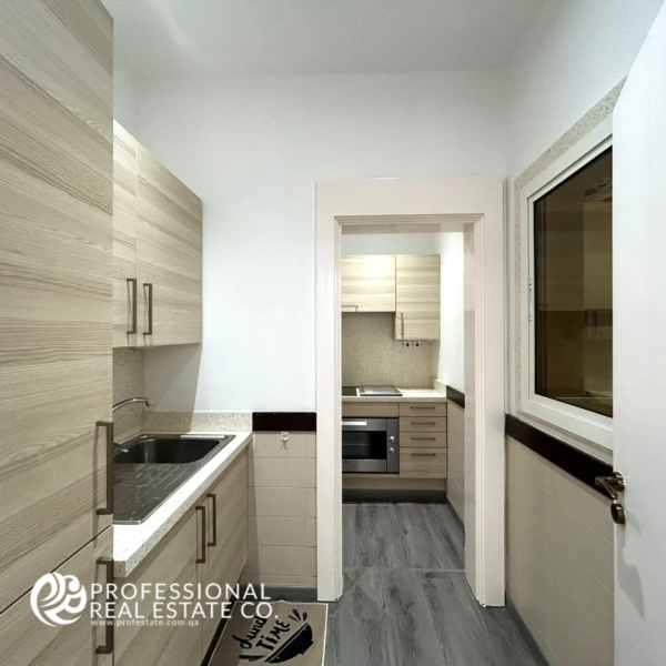 Compact yet functional pantry with efficient storage, enhancing the modern kitchen in a fully furnished 5 BHK villa in Umm Lekhba.