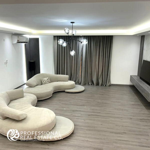 Elegant 3rd living room in a fully furnished, spacious 5 BHK standalone villa in Umm Lekhba, featuring modern decor, luxurious furnishings, and ample space for relaxation and entertainment.