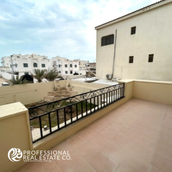 Spacious balcony in a fully furnished, luxurious 5 BHK standalone villa in Umm Lekhba, offering stunning views and an ideal space for outdoor relaxation.