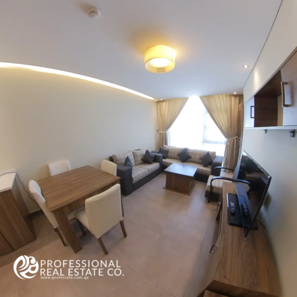 Dining area and living room in the fully furnished 1-bedroom apartment in Al Sadd, Doha, featuring an open-plan layout, modern furnishings, and plenty of natural light, creating a comfortable and stylish living space.