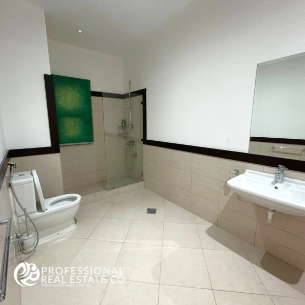 Spacious and elegantly designed Bathroom 1 in a fully furnished, luxurious 5 BHK standalone villa in Umm Lekhba, featuring high-end fixtures, modern design, and premium finishes.