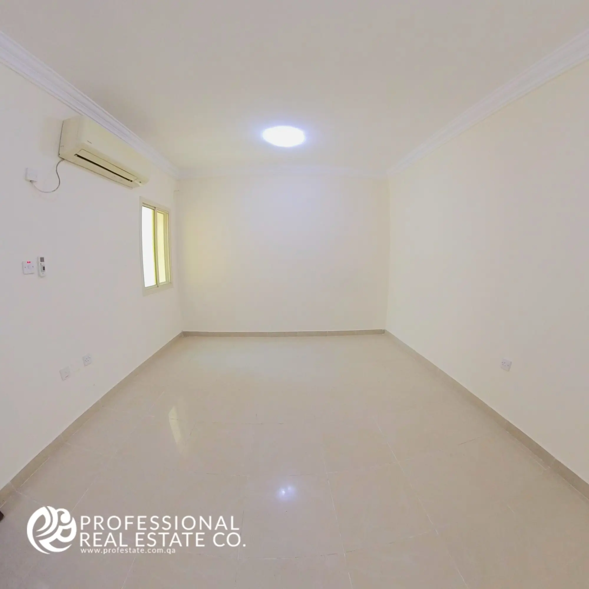 Bedroom 1 with tiled flooring and neutral walls in an unfurnished 2 BHK apartment in Al Sadd, Doha