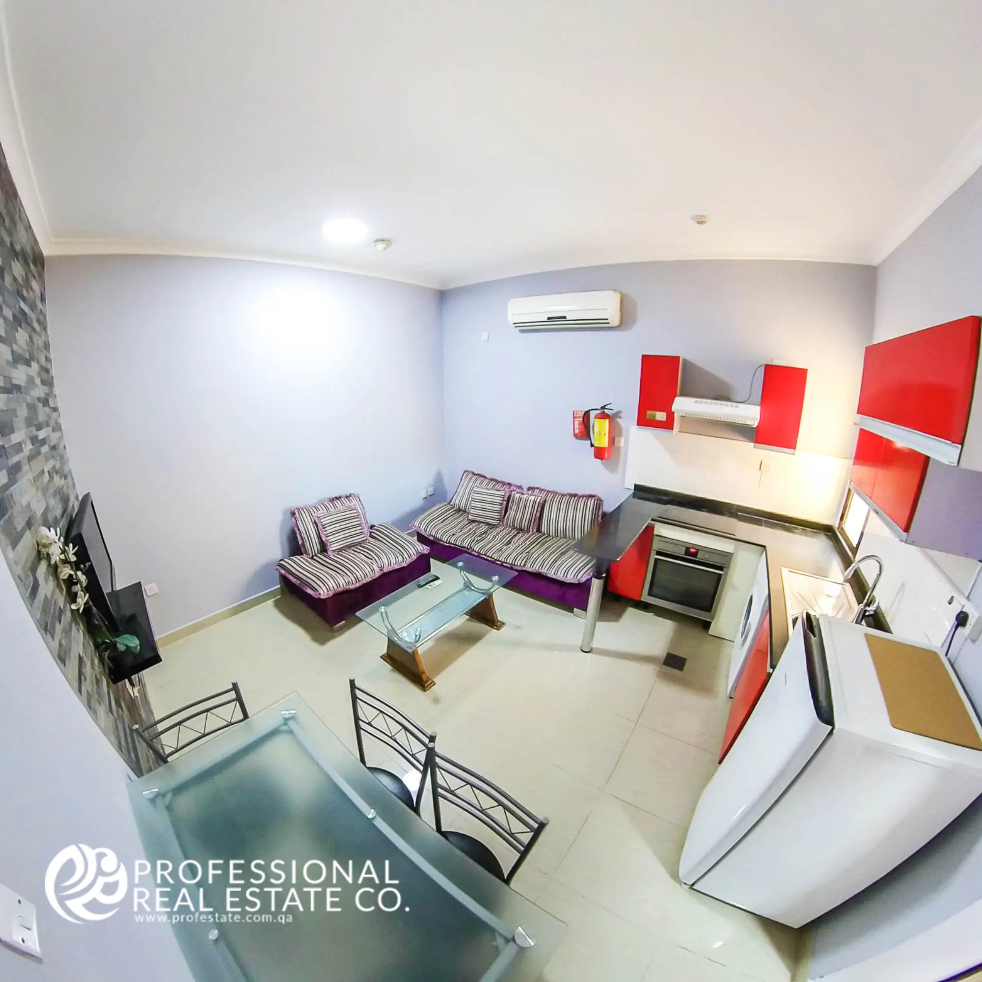 Modern living room and dining area in a fully furnished 1 BHK apartment in Muaither, designed for comfort and style.