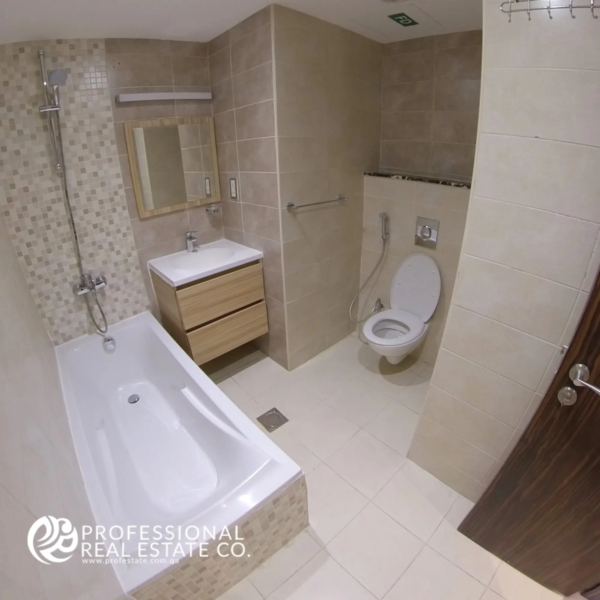 Stylish and well-appointed bathroom in a fully furnished 1-bedroom apartment in Al Sadd, Doha, featuring modern fixtures and a clean, contemporary design, offering comfort and convenience in a prime location.