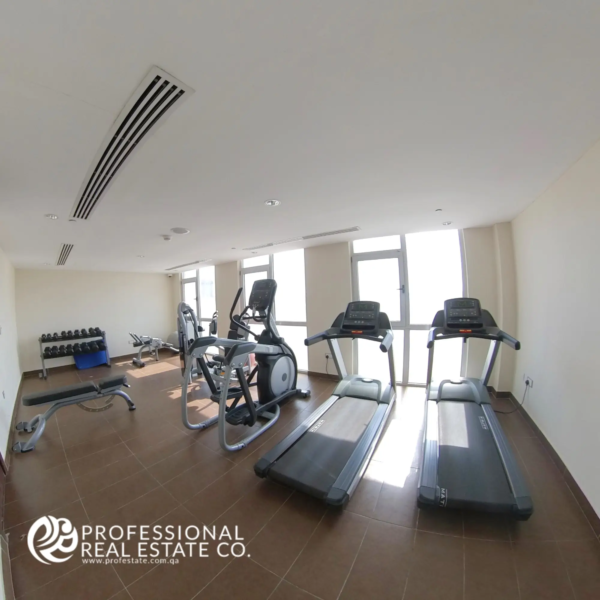 Modern, fully equipped gym in the building of a fully furnished 1-bedroom apartment in Al Sadd, Doha, offering residents a convenient space for fitness and wellness in a prime location.