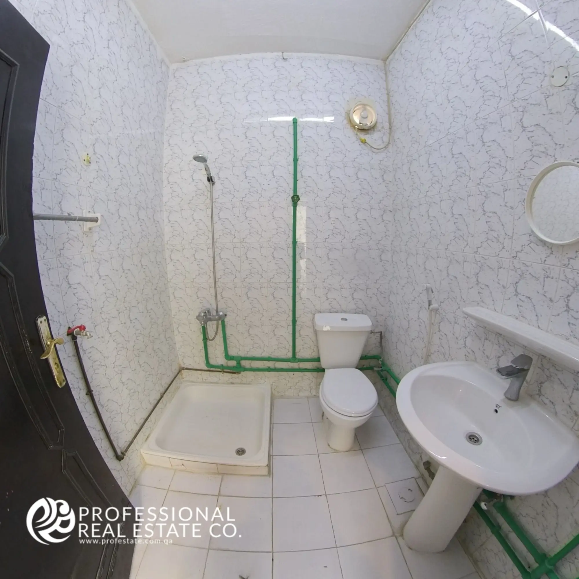 Cozy bathroom in an unfurnished 1 BHK apartment in Umm Lekhba, featuring modern fixtures and a clean, functional layout perfect for daily use.