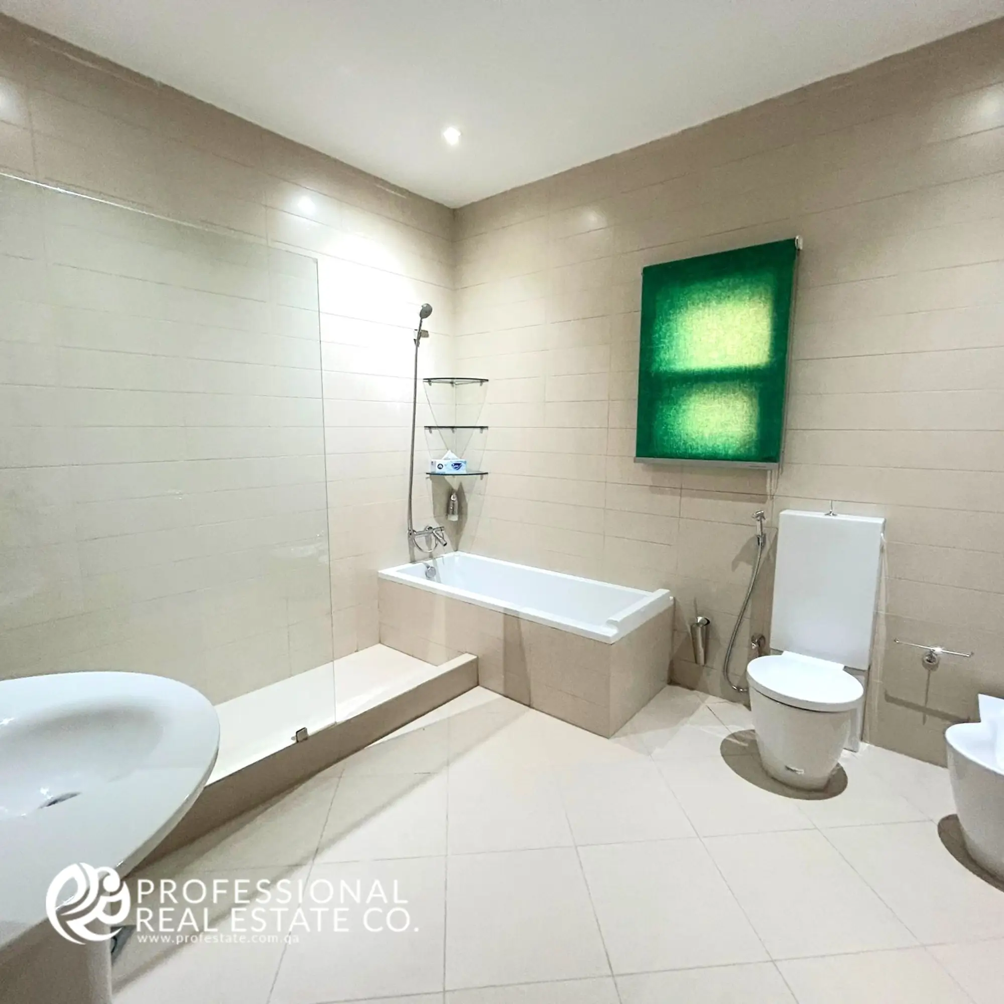 Luxurious bathroom with a bathtub, separate shower compartment, and modern toilet in a fully furnished 5 BHK standalone villa in Umm Lekhba.