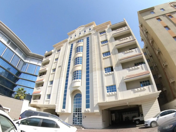 External view of the modern building featuring an unfurnished 2 BHK apartment in Najma, showcasing clean architecture and a prime location.