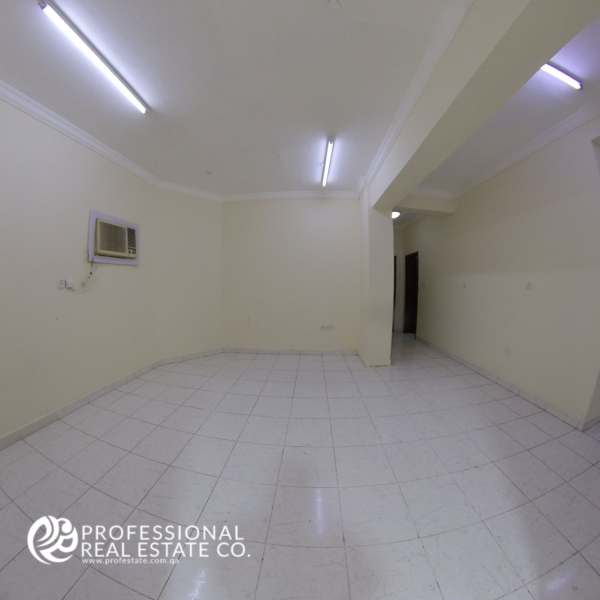 Alternative view of the spacious living room in an unfurnished 2 BHK apartment in Najma, featuring a bright and open layout ready for customization.
