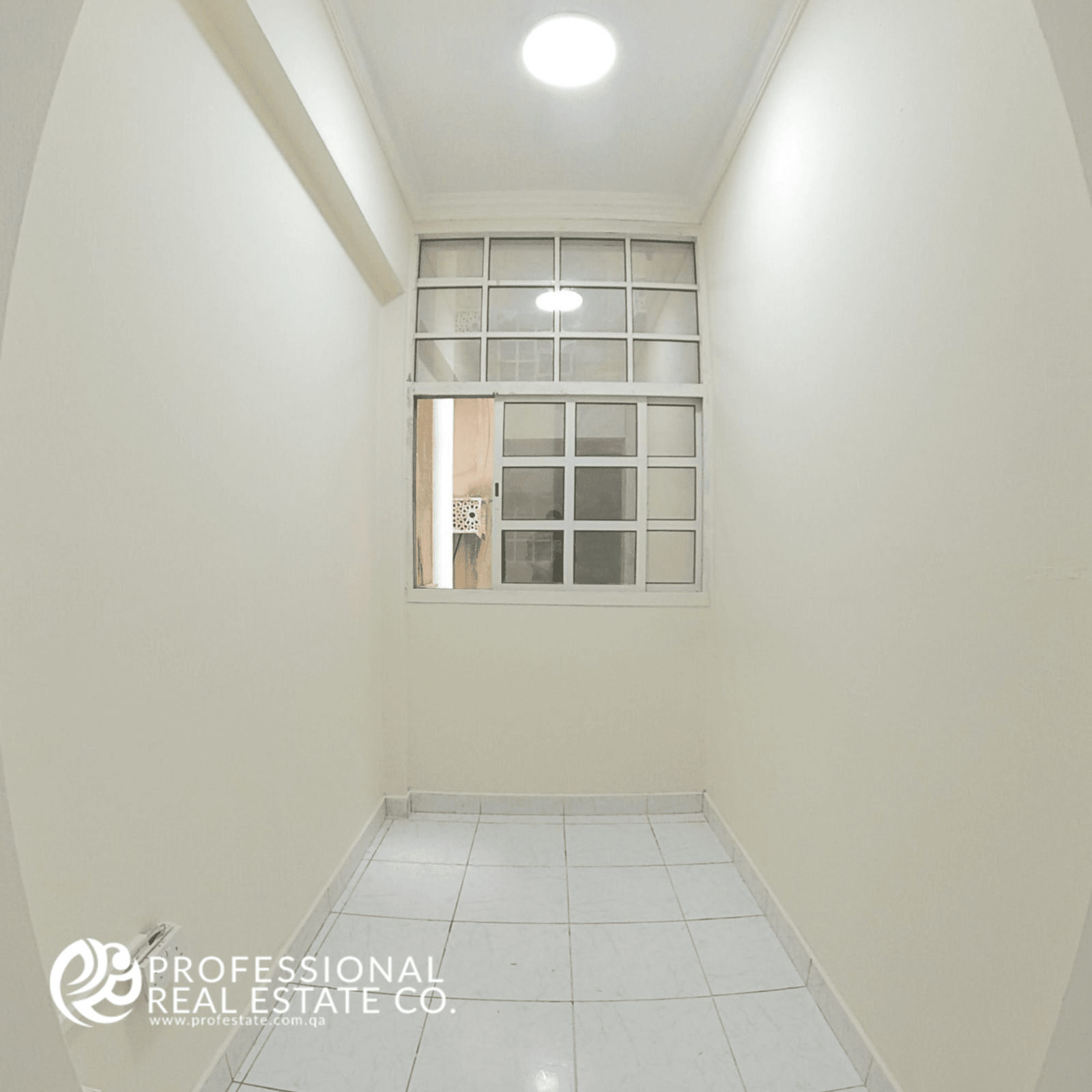 Window side of the spacious living room in an unfurnished 2 BHK apartment in Najma, featuring plenty of natural light and a bright, open atmosphere.