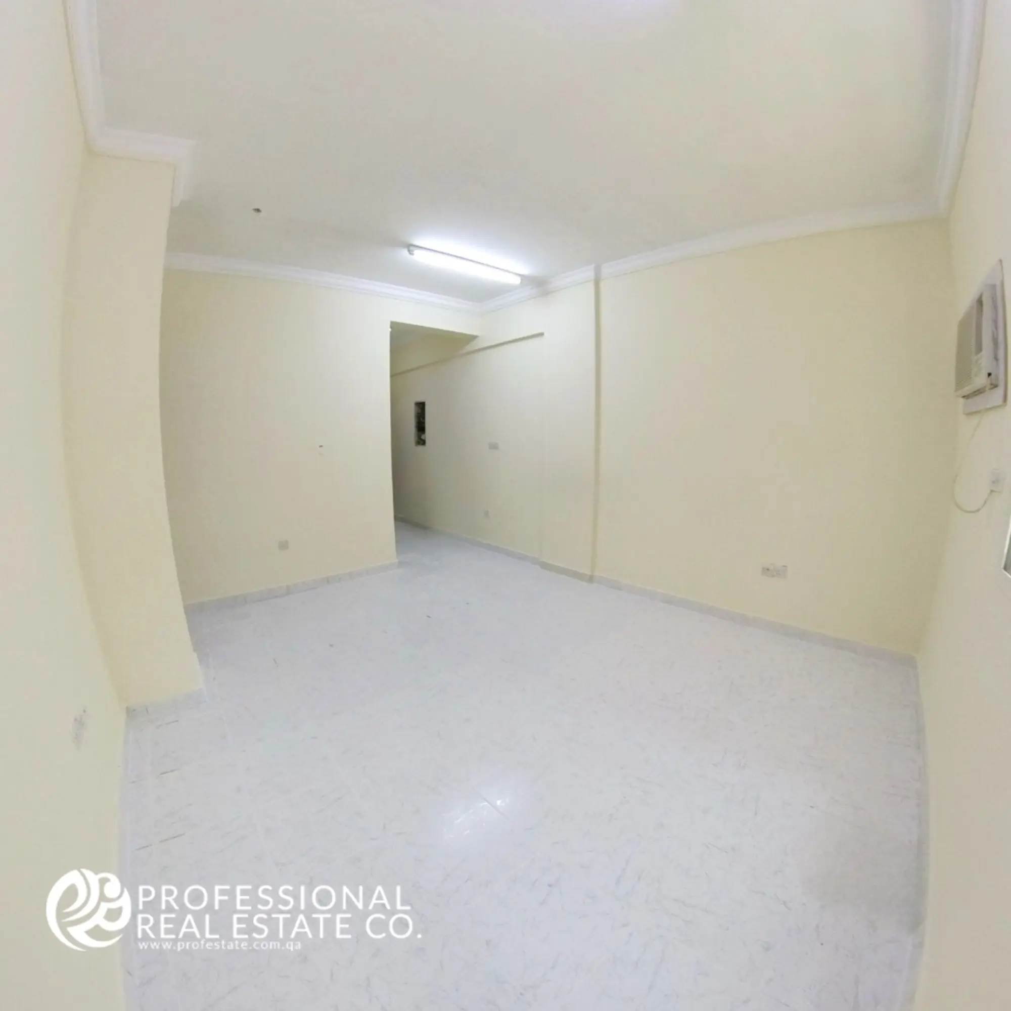 Alternative view of living room with tiled floor and natural light in 2 BHK apartment in Najma, Doha