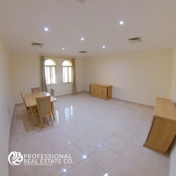 View entering the living room featuring the dining area in a semi-furnished 2 BHK apartment in Muntazah, Doha