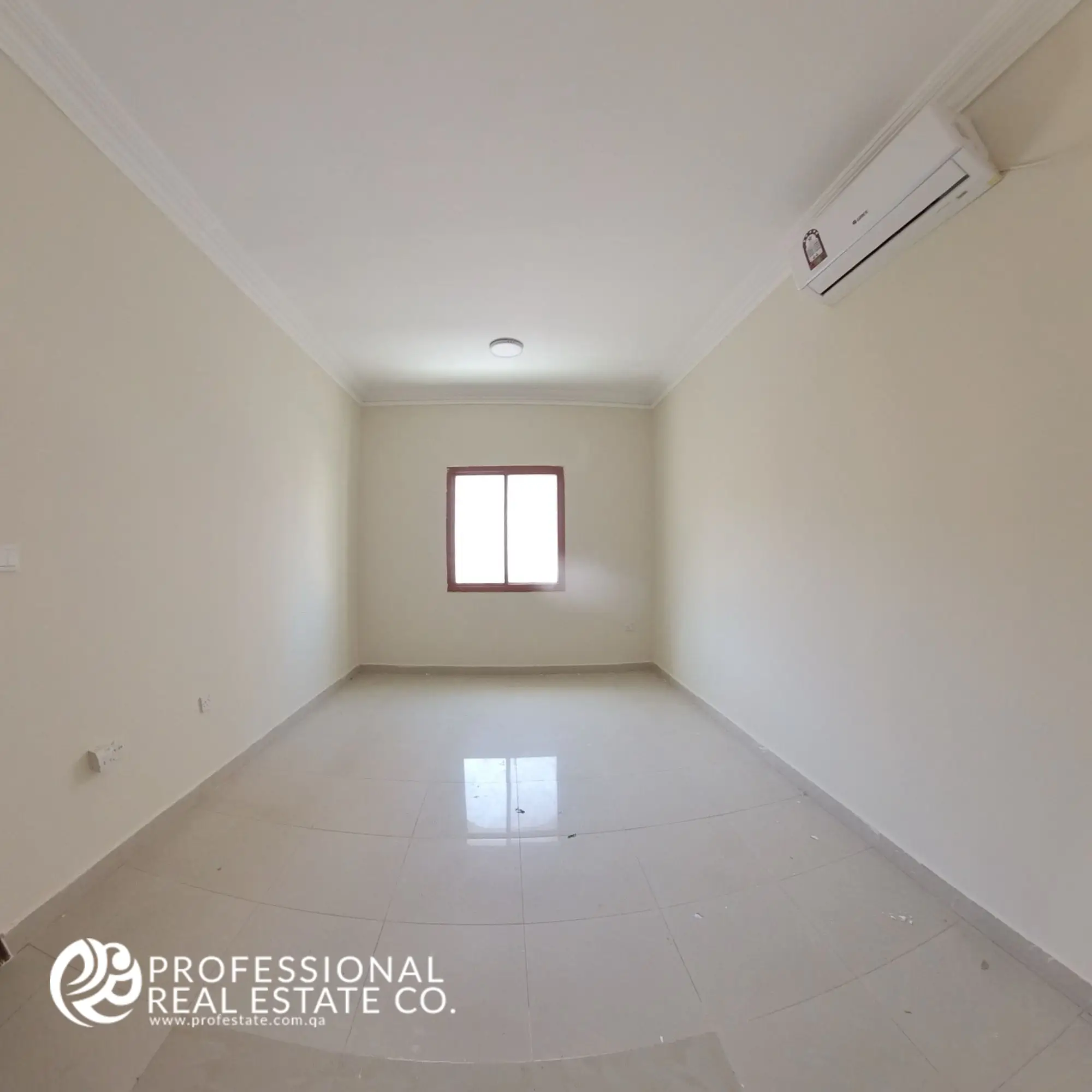 Second bedroom with neutral finishes in an unfurnished 2 BHK apartment in Muntazah, Doha