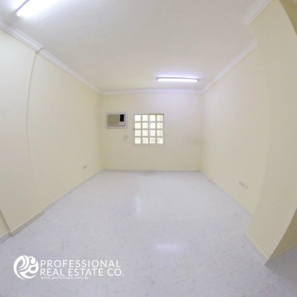 Spacious living room with tiled flooring in unfurnished 2 BHK apartment in Najma, Doha