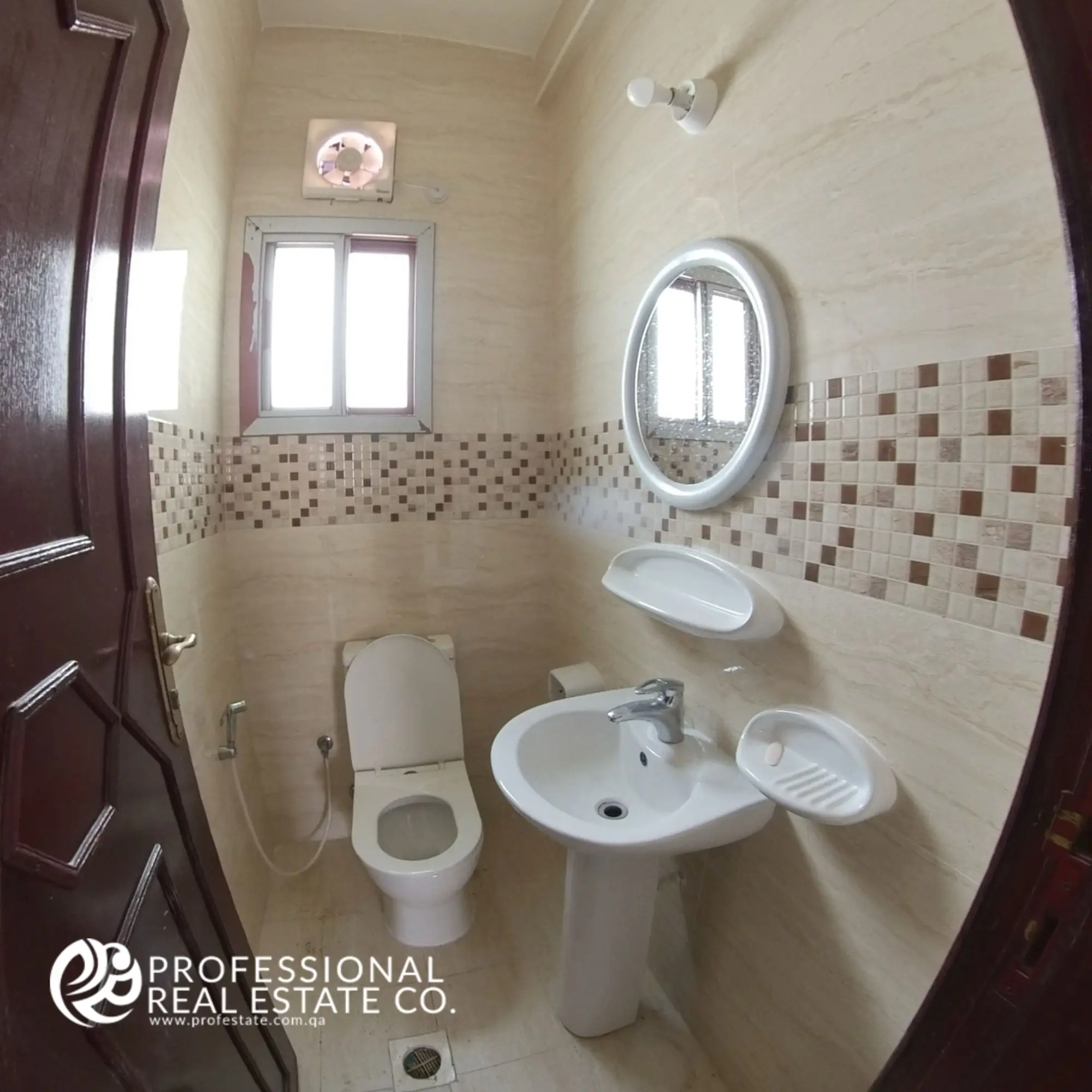 Guest toilet room with modern fixtures in an unfurnished 2 BHK apartment in Muntazah, Doha
