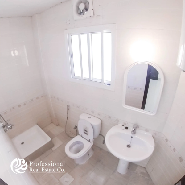 Clean bathroom with tiled walls and shower in unfurnished 1 BHK apartment in Umm Ghuwailina, Doha