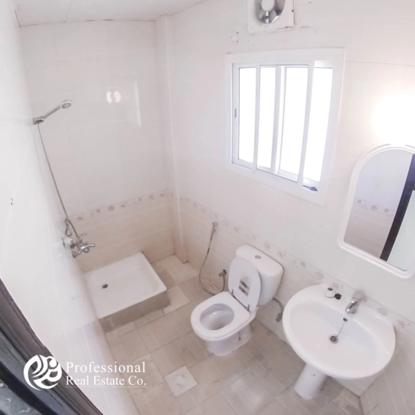 Alternate view of bathroom with tiled walls and shower area in 1 BHK apartment in Umm Ghuwailina, Doha