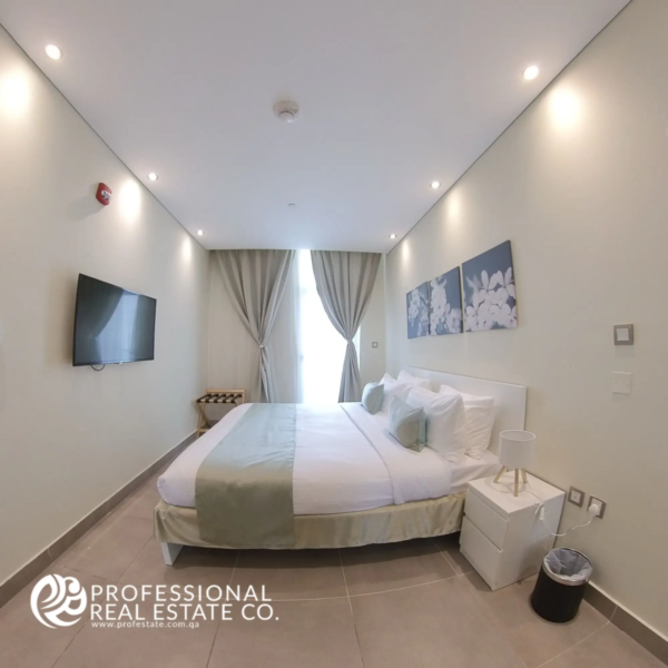 Bedroom in a fully furnished 1 BHK apartment in Al Sadd, featuring modern furnishings, ample natural light, and a cozy design.