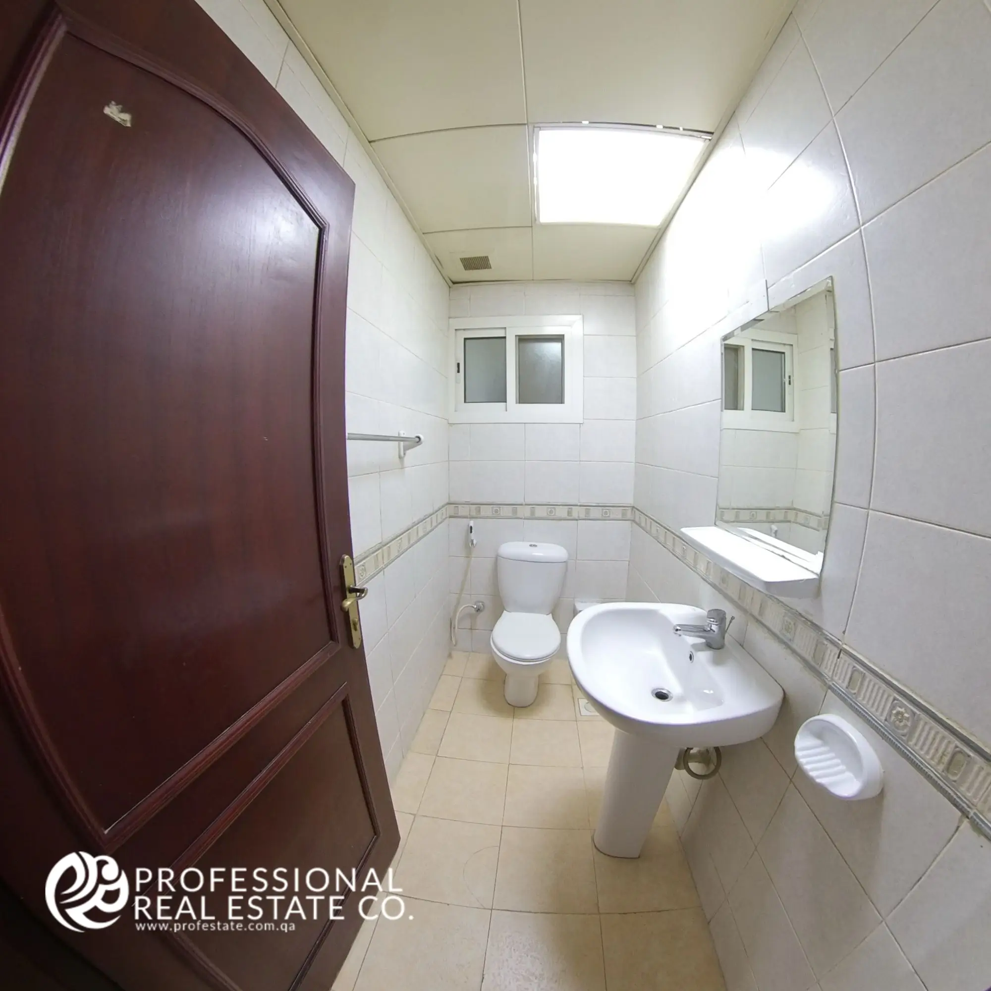 Guest toilet with shower compartment in an unfurnished 3 BHK apartment in Bin Mahmoud, Doha