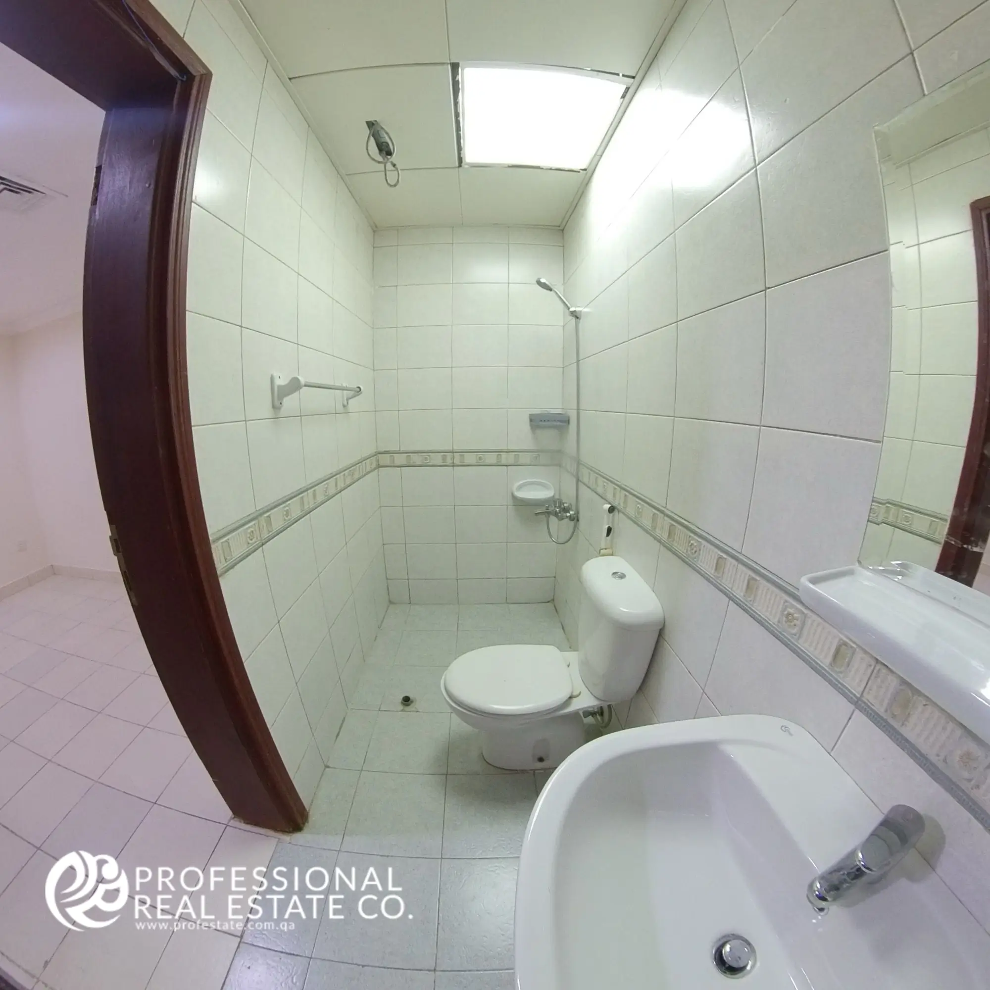 Second toilet with shower compartment in an unfurnished 3 BHK apartment in Bin Mahmoud, Doha