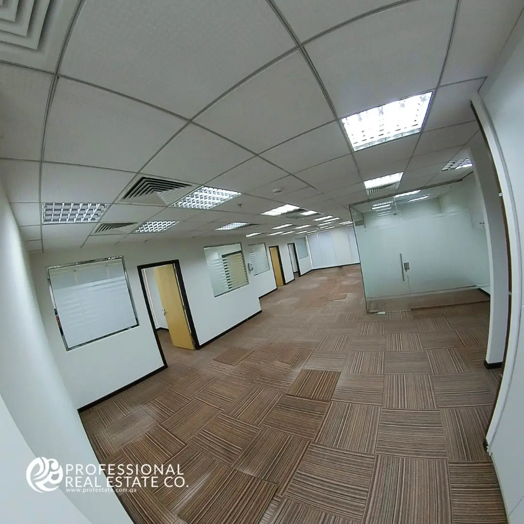Another section of the main open office area in unfurnished office open space in Bin Mahmoud, Doha
