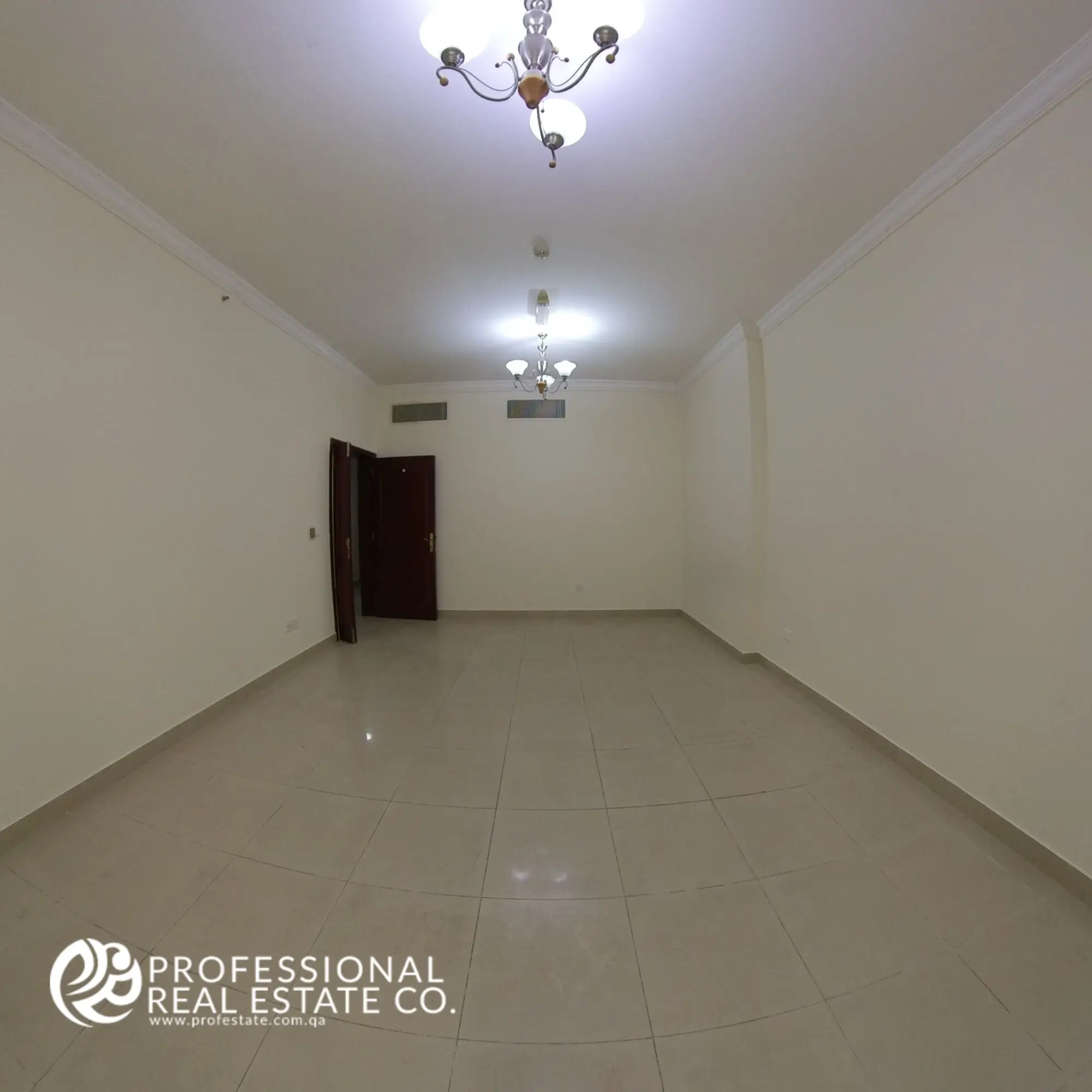 Living room alternative view facing main door in an unfurnished 3 BHK apartment in Bin Mahmoud, Doha